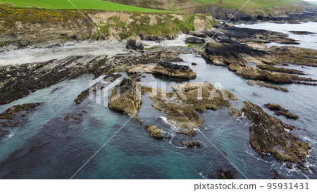 Bright rocky coast. Beautiful Northern European nature. Aerial view of the rocky coastline. Aerial photo. Drone point of view. Bright rocky coast. Beautiful Northern European nature. Aerial view of the rocky coastline. Aerial photo. Drone point of view. 95931431