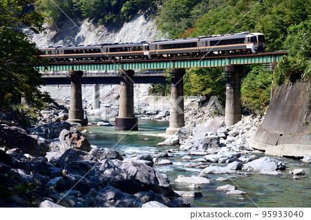 Limited Express Hida on the Takayama Main Line, crossing the iron bridge over the Hida River Limited Express Hida on the Takayama Main Line, crossing the iron bridge over the Hida River 95933040