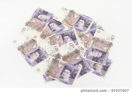 Closeup flat lay of scattered UK pounds. Concept Finance Business Investment Success Closeup flat lay of scattered UK pounds. Concept Finance Business Investment Success 95935907