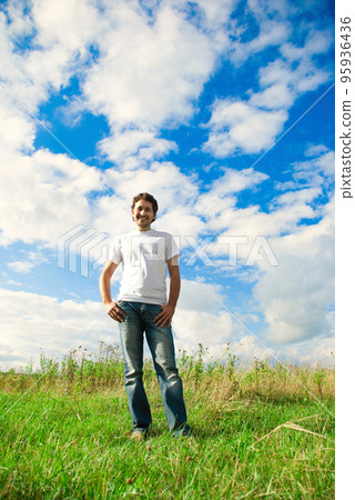 man standing in a field 95936436