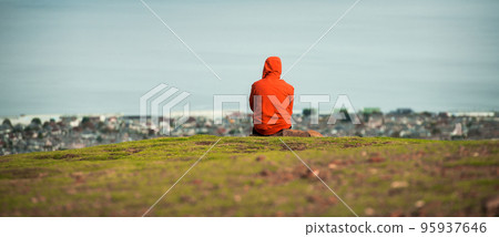 Man back view on the top of the Edinburgh mountains, Scotland. Meditation yoga and relax. Travel Lifestyle relaxation emotional concept adventure summer vacations outdoor harmony with nature Man back view on the top of the Edinburgh mountains, Scotland. Meditation yoga and relax. Travel Lifestyle relaxation emotional concept adventure summer vacations outdoor harmony with nature 95937646