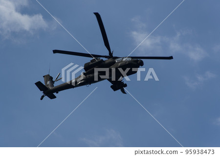 Boeing AH-64 attack helicopter on formation during an air show. Greek Air Force Apache flying on Thessaloniki, Greece during the 28 October National Oxi Day parade. 95938473
