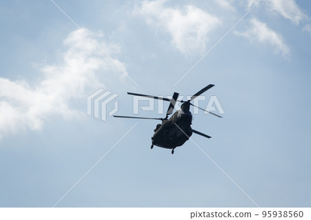 Boeing CH-47 Chinook during an air show. Greek Air Force twin-engine lift helicopter flying on Thessaloniki, Greece during the 28 October National Oxi Day parade. 95938560