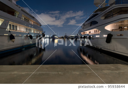many ships at night on the pier in the Aegean Sea Athens Greece many ships at night on the pier in the Aegean Sea Athens Greece 95938644