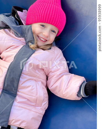 Cute little lgirl wearing pink woolen hat Cute little lgirl wearing pink woolen hat 95938999