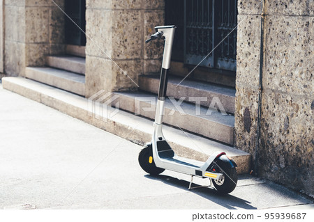 E-scooter for rent for mobility in the city. Electric scooter for public sharing in european city center 95939687