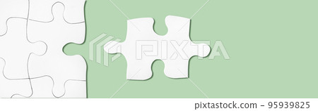 Puzzle on green surface. Connecting, network idea. Metaphor of teamwork, problem solving 95939825