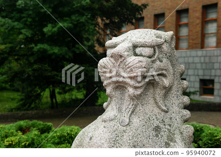 head of traditional Japanese statue of a stone lion at the entrance to the Sakhalin Museum of Local Lore head of traditional Japanese statue of a stone lion at the entrance to the Sakhalin Museum of Local Lore 95940072