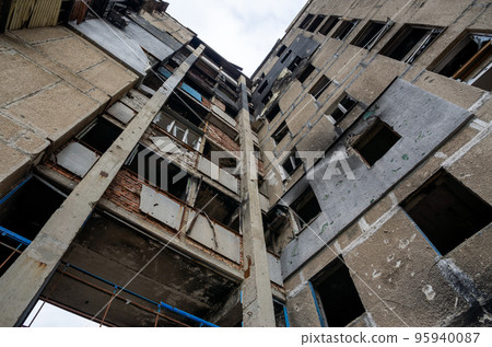 destroyed and burned houses in the city during the war in Ukraine destroyed and burned houses in the city during the war in Ukraine 95940087