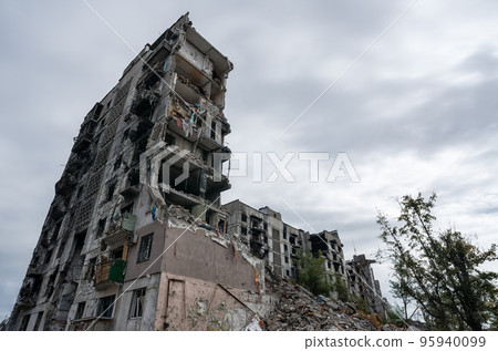 destroyed and burned houses in the city during the war in Ukraine destroyed and burned houses in the city during the war in Ukraine 95940099