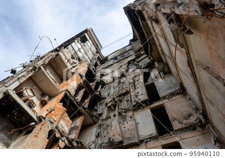 destroyed and burned houses in the city during the war in Ukraine destroyed and burned houses in the city during the war in Ukraine 95940110