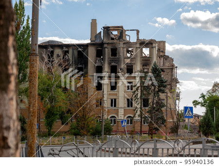 destroyed and burned houses in the city during the war in Ukraine 95940136