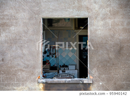 destroyed and burned houses in the city during the war in Ukraine 95940142