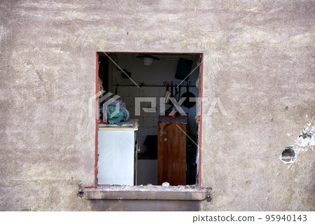 destroyed and burned houses in the city during the war in Ukraine 95940143