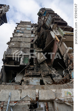 destroyed and burned houses in the city during the war in Ukraine destroyed and burned houses in the city during the war in Ukraine 95940347