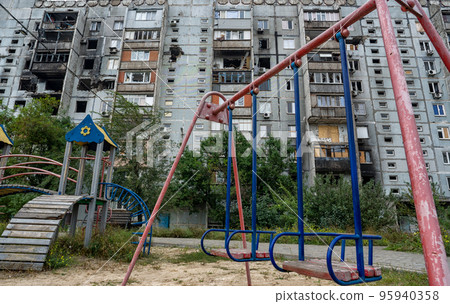 destroyed and burned houses in the city during the war in Ukraine 95940358