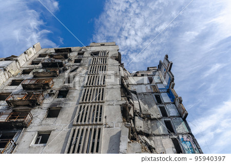 destroyed and burned houses in the city during the war in Ukraine destroyed and burned houses in the city during the war in Ukraine 95940397
