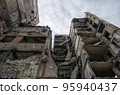 destroyed and burned houses in the city during the war in Ukraine 95940437