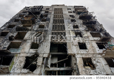 destroyed and burned houses in the city during the war in Ukraine 95940438