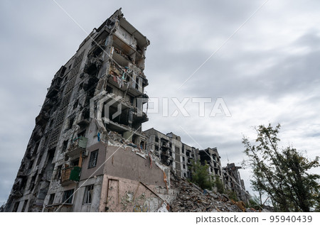 destroyed and burned houses in the city during the war in Ukraine destroyed and burned houses in the city during the war in Ukraine 95940439