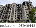 destroyed and burned houses in the city during the war in Ukraine 95940442