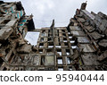 destroyed and burned houses in the city during the war in Ukraine 95940444
