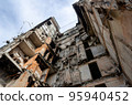 destroyed and burned houses in the city during the war in Ukraine 95940452