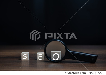 Magnifying glass with SEO wooden block, Search Engine Optimization(SEO) Technology for Mobile Phone, Smartphone, Computer, Web Page, Website, Social Media Ranking and Speed. Magnifying glass with SEO wooden block, Search Engine Optimization(SEO) Technology for Mobile Phone, Smartphone, Computer, Web Page, Website, Social Media Ranking and Speed. 95940555