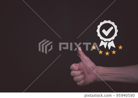 Businessman raised thumps up with Satisfaction Guarantee and five stars rating, sign of the top service Quality assurance, Standards, ISO certification and standardization concept.. Businessman raised thumps up with Satisfaction Guarantee and five stars rating, sign of the top service Quality assurance, Standards, ISO certification and standardization concept.. 95940580