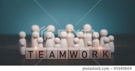 Teamwork concept, Wooden doll working together with Teamwork.. 95940604