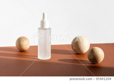 Skin moisturizing serum on white brown backdrop with decor. Beauty skincare mockup, branding spa, wellness packaging. Serum eco cosmetic product. Natural cosmetic concept. Skin moisturizing serum on white brown backdrop with decor. Beauty skincare mockup, branding spa, wellness packaging. Serum eco cosmetic product. Natural cosmetic concept. 95941204