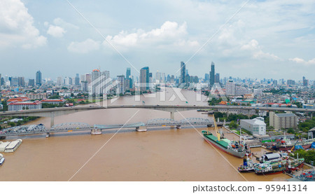 Aerial view of Bangkok City skyline by Chao Phraya River in Thailand. Financial district and skyscraper office buildings. Downtown skyline. Urban town. 95941314