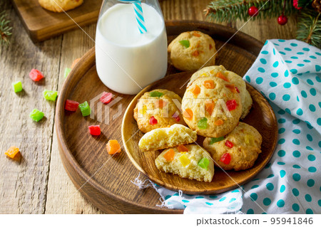 Baked Christmas cookies. Homemade Chip Cookies with Zest and Candied Fruit on a wooden table. Copy space. Baked Christmas cookies. Homemade Chip Cookies with Zest and Candied Fruit on a wooden table. Copy space. 95941846