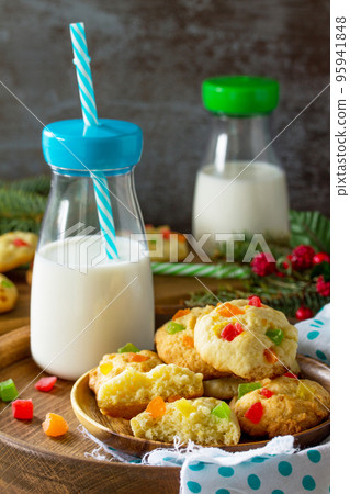 Baked Christmas cookies. Homemade Chip Cookies with Zest and Candied Fruit on a wooden table. Baked Christmas cookies. Homemade Chip Cookies with Zest and Candied Fruit on a wooden table. 95941848