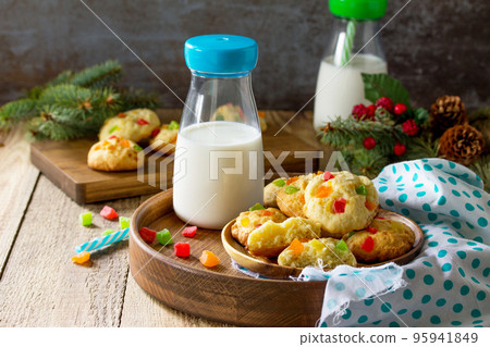 Baked Christmas cookies. Homemade Chip Cookies with Zest and Candied Fruit on a wooden table. Copy space. Baked Christmas cookies. Homemade Chip Cookies with Zest and Candied Fruit on a wooden table. Copy space. 95941849
