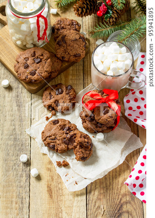 Baked Christmas cookies. Homemade Chocolate Chip Cookies on a wooden table. Copy space. Baked Christmas cookies. Homemade Chocolate Chip Cookies on a wooden table. Copy space. 95941895