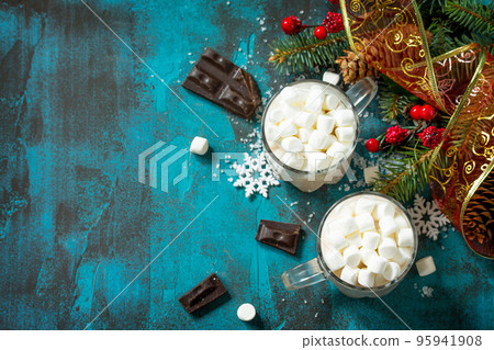 Hot Chocolate with Marshmallows on a blue stone or concrete table. Copy space. 95941908