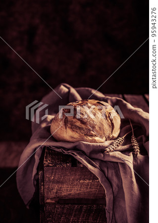 Homemade bread and cloth napkin at table. Bakery concept on wood tabletop 95943276