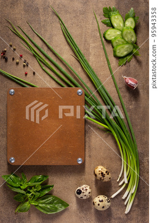 Quail eggs and green onion chives at table background. Cooking concept and salad ingredients Quail eggs and green onion chives at table background. Cooking concept and salad ingredients 95943358