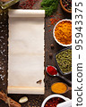 Variety of spices and herbs with cookbook paper at table background 95943375