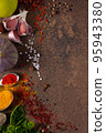 Variety of spices and herbs at table background. Cooking concept and ingredients 95943380