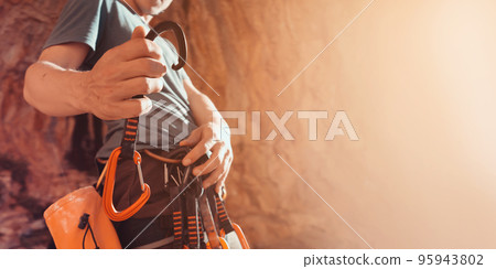 Man is climbing, hiking in the mountains. 95943802