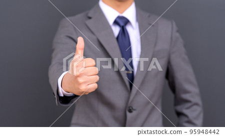 A businessman doing a good sign 95948442