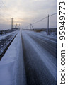 Straight road in Hokkaido in winter 95949773