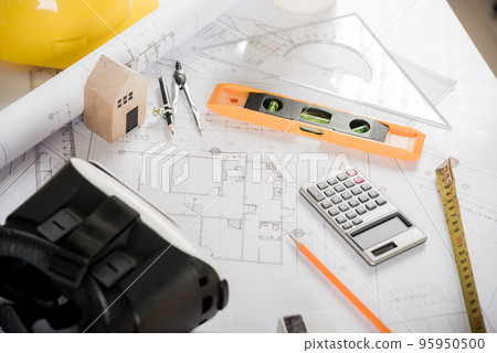 Architect workplace top view. Architectural blueprint paper project plans on desk table, tool for engineer contractor building design working drawing and VR glasses, industry virtual technology Architect workplace top view. Architectural blueprint paper project plans on desk table, tool for engineer contractor building design working drawing and VR glasses, industry virtual technology 95950500