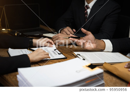 Close up businessman or Lawyer signing contract making a deal, classic business at office. Close up businessman or Lawyer signing contract making a deal, classic business at office. 95950956