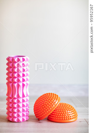 pink massage roller for neck, shoulders and back and orange foot massager. pink massage roller for neck, shoulders and back and orange foot massager. 95952167