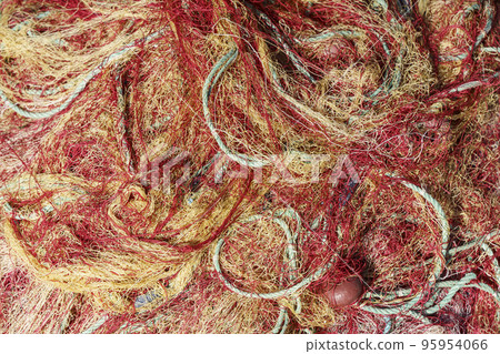 Fishing nets close up abstract background. Nylon fishing nets on a boat. 95954066