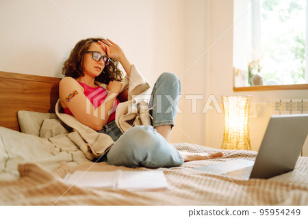 Woman blogger videotapes her vlog at home and speaking about Vaccine for covid-19. Woman blogger videotapes her vlog at home and speaking about Vaccine for covid-19. 95954249