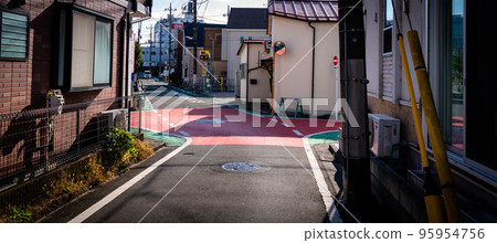 Intersection in a residential area without traffic lights 95954756